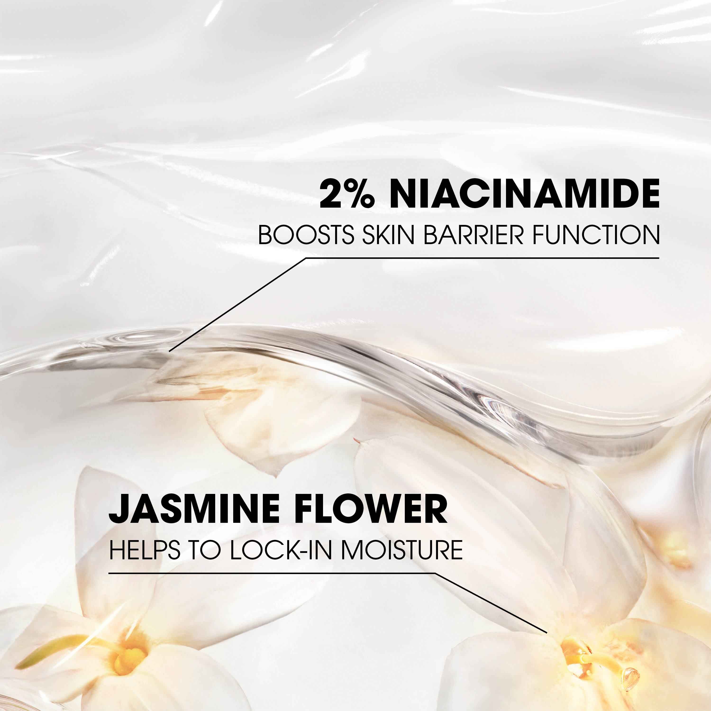 Hand with black nails holding Care Crush Hand & Body serum-in-cream, a white heart-shaped .
