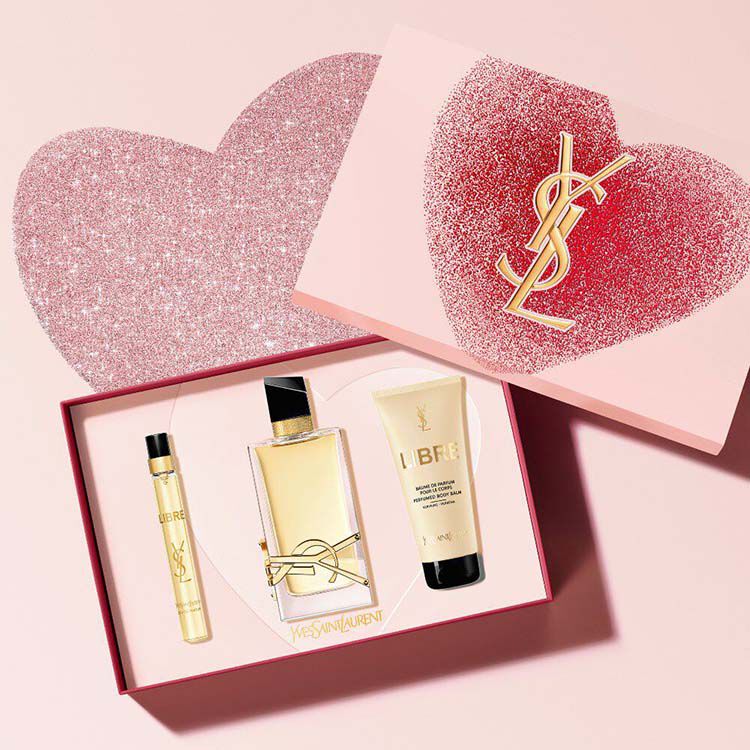 Libre Eau de Parfum Valentine's Day gift set, with 90ml, 10ml, and perfumed body balm, in a pink box with glitter hearts.