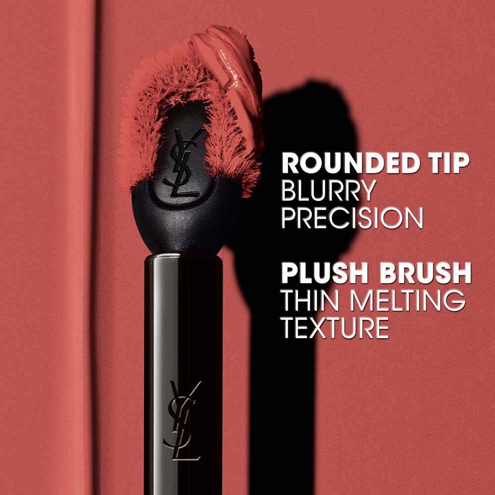 Close-up of YSL The Inks Blur applicator with its rounded tip and plush brush for precise application.