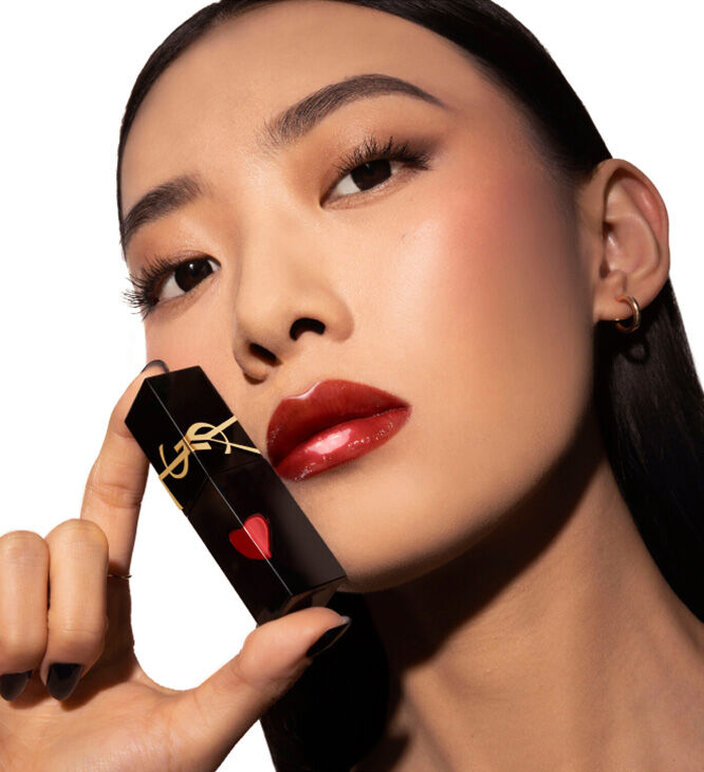 Models wearing different shades of YSL The Inks Vinyl Cream, demonstrating the glossy, long-wearing formula