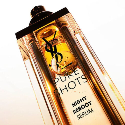 Close-up of YSL Pure Shots Night Reboot Serum bottle, representing the YSL Beauty skincare category.
