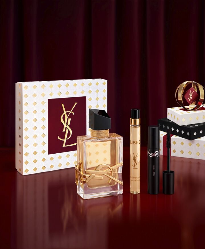 LIBRE Eau de Parfum Holiday set with full-size bottle, travel spray, and mini mascara in a YSL gift box displayed on white and gold Holiday gift packaging.