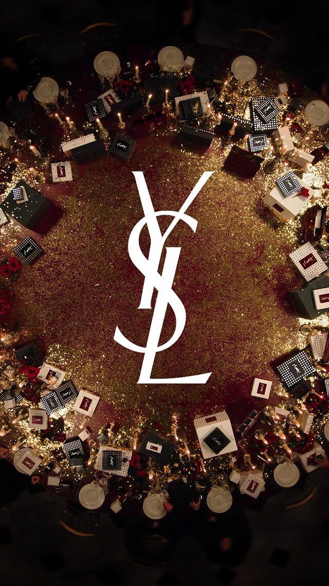 Video of guests at a festive YSL dinner, sharing joy and gifting luxury holiday sets in a decadent atmosphere.