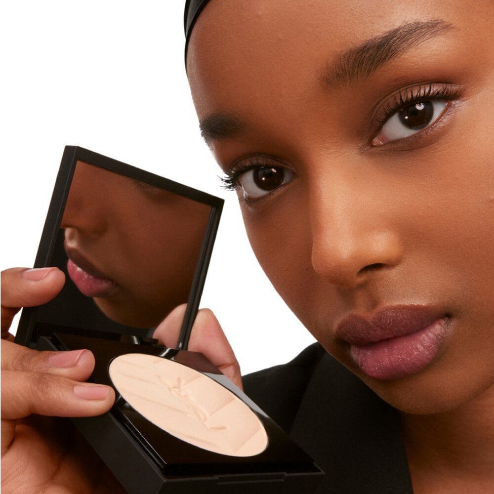 Model applying YSL All Hours Hyper Finish Powder highlighting its airy, breathable texture