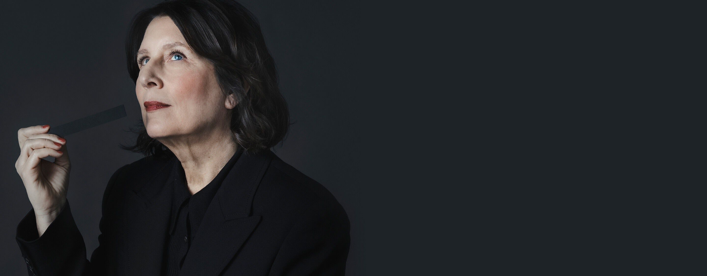 Master Perfumer Daniela Andrier
holding a scent strip, creator of the
radical YSL CŒUR signature.