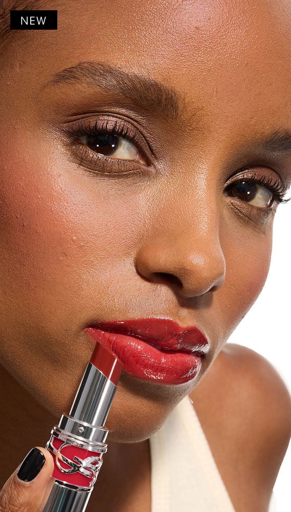 Model Zahara applies YSL LOVESHINE Lipstick in Berry Crush, shade 219, to her glossy lips.