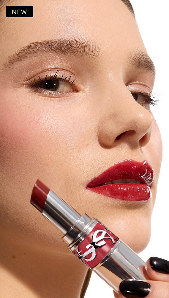Model Veerle applies YSL LOVESHINE Lipstick in Berry Crush, shade 219, to her glossy lips.